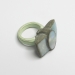 Opal Ribbon, 2016. Ring height 32 mm.Opal, wood, paint, cement.