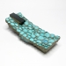 Piscine, 2016. Brooch 14 x 6 x 3 cm. Glass, wood, cement, paint, silver.